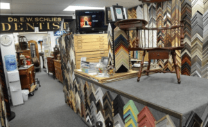 Frame shop interior with wooden chair