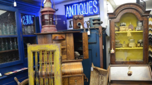 Antique shop interior with neon antiques sign