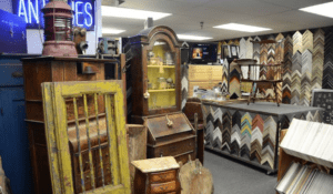 Antique shop interior with wooden furniture and frames
