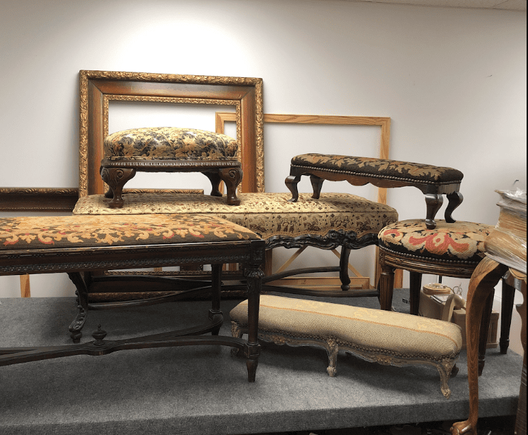 Antique upholstered footstools and ornate frames