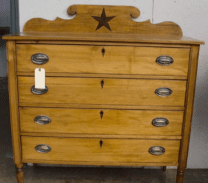 Vintage four-drawer wooden dresser with star