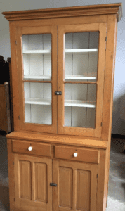 Wooden display hutch with glass doors and drawers