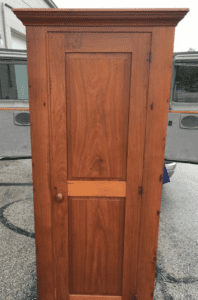 Tall antique wooden single door wardrobe