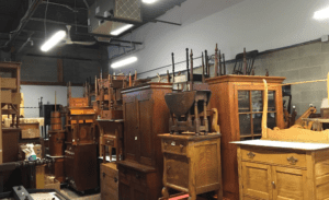 Antique wooden furniture stored in warehouse