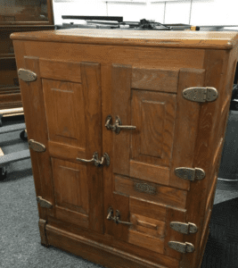 Antique wooden icebox with metal latches