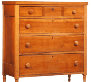 Antique wooden chest of drawers with knobs