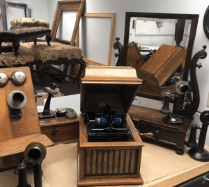 Antique phonographs and candlestick telephones
