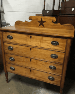 Antique wooden dresser with star backboard