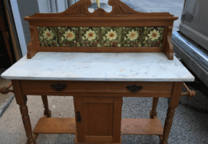 Antique wooden washstand with marble top